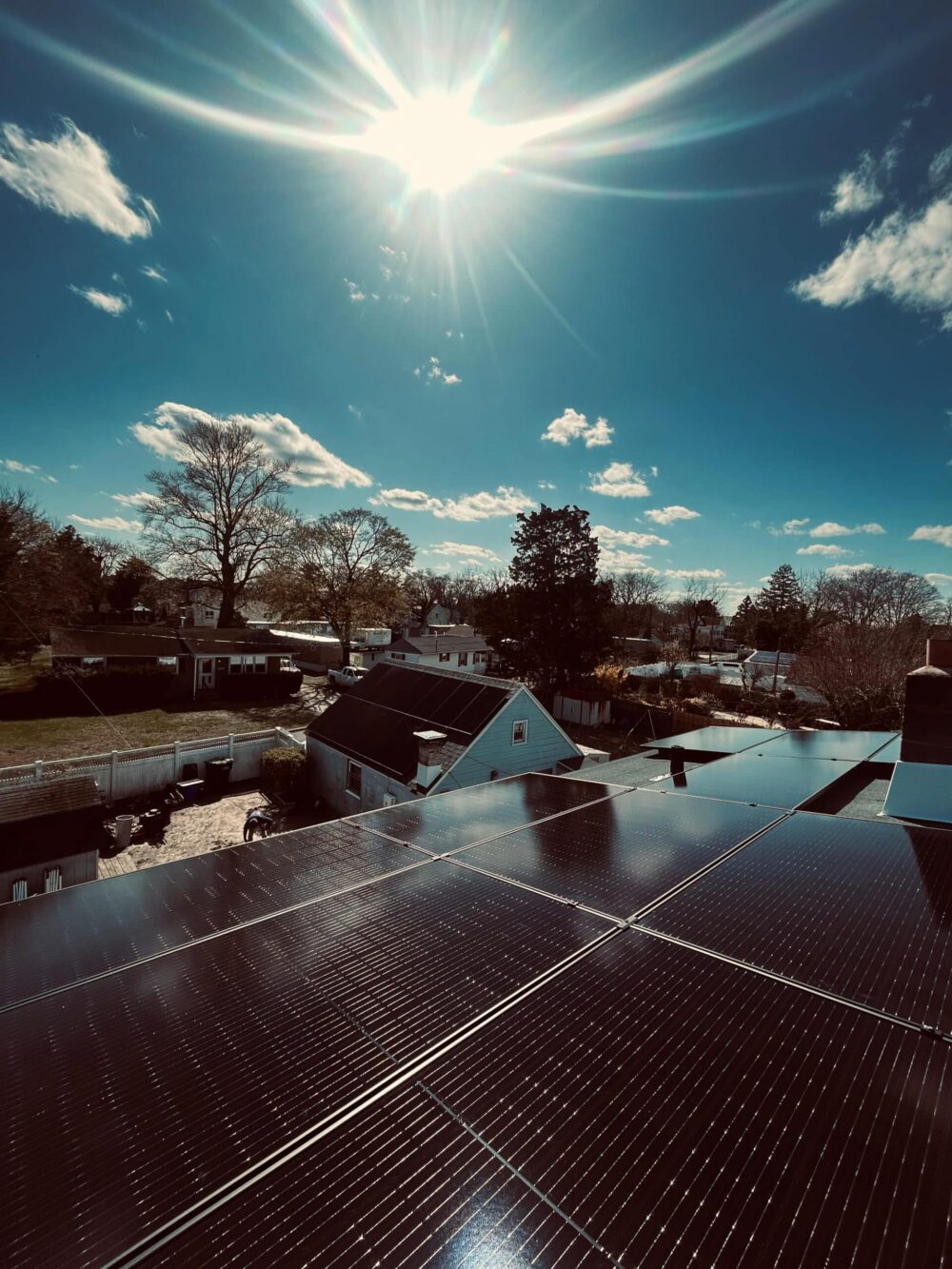 the sky and solar panels on a roof